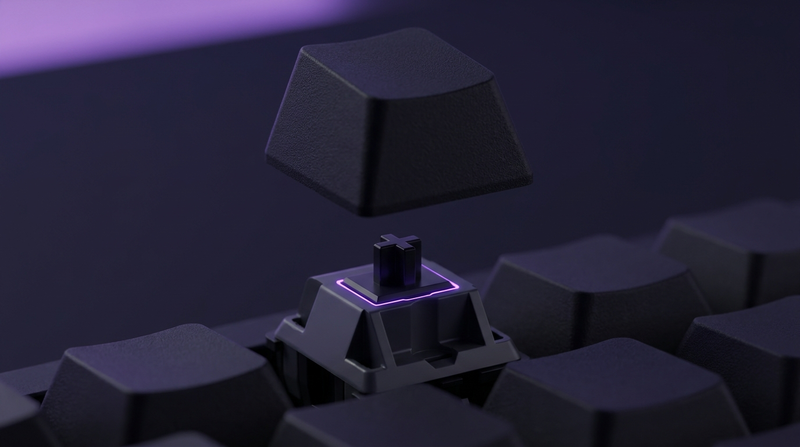 A single keycap lifted above a mechanical switch, showing the cross-shaped MX stem underneath
