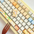 Close-up of the Mango Yogurt Bear character keycap design