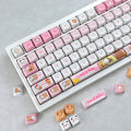 Bubu & Yier round keycaps shown from a different angle