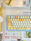 Mango Yogurt Bear keycaps installed on a keyboard, side view