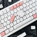 Sweet Bobo keycaps installed on a mechanical keyboard, red and white