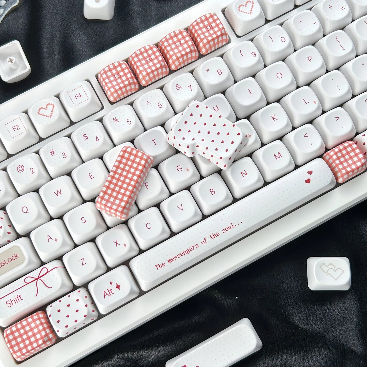 Sweet Bobo keycaps installed on a mechanical keyboard, red and white