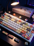 Bangboo Zenless Zone Zero keycap set on a cozy night desk, Midnight Atelier lighting