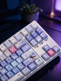 Columbina Genshin Impact keycap set on a cozy desk with plant and lamp
